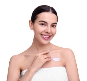 Beautiful woman with smear of body cream on her chest against white background