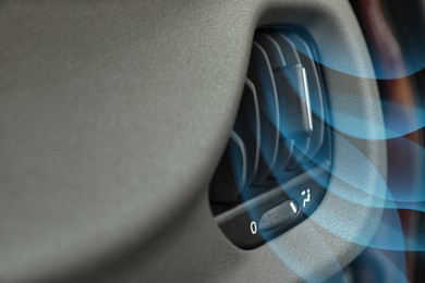 Image of Closeup view of conditioning system in car and illustration of cool air flow