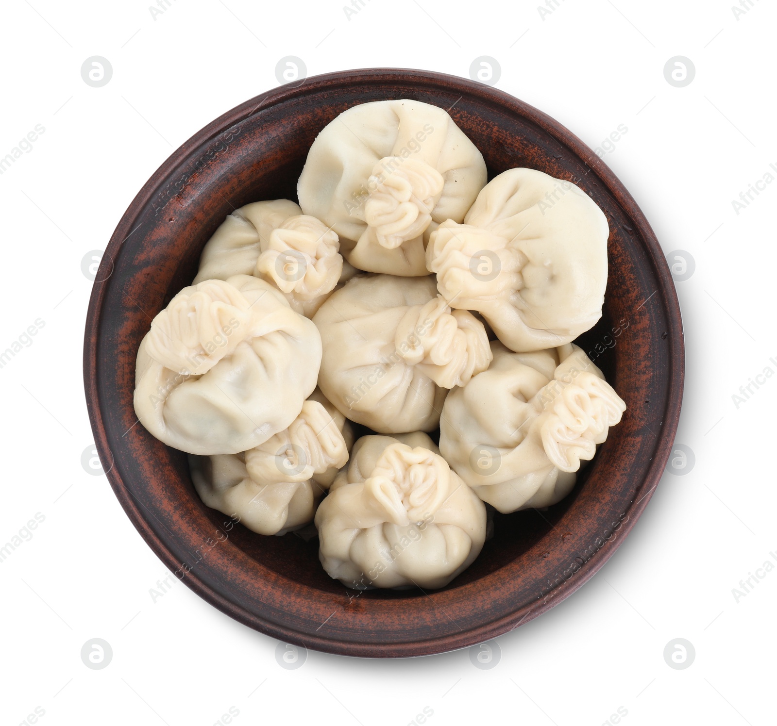 Photo of Tasty khinkali (dumplings) in bowl isolated on white, top view. Georgian cuisine
