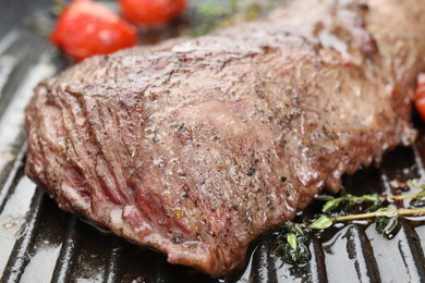 Photo of Delicious grilled beef meat in pan, closeup