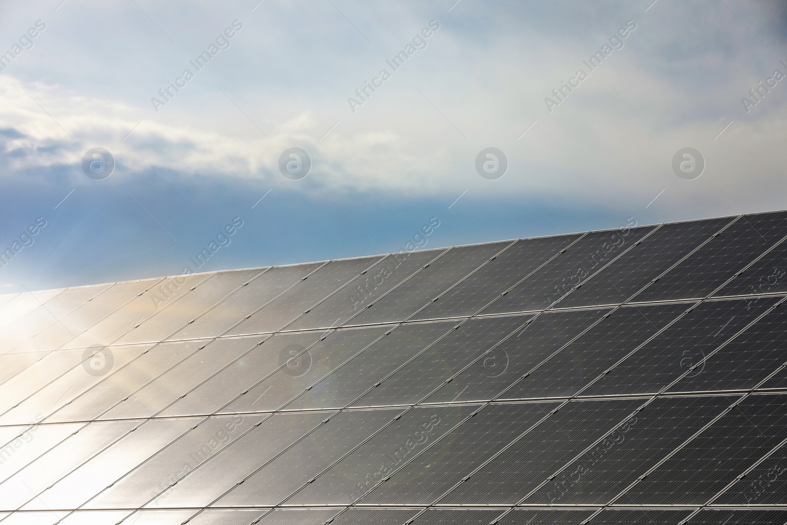 Photo of Solar panels installed outdoors. Alternative energy source