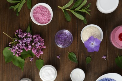 Photo of Flat lay composition with homemade cosmetic products and fresh ingredients on wooden table