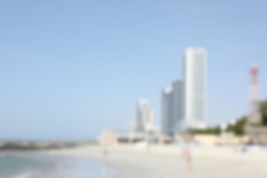 AJMAN, UNITED ARAB EMIRATES - NOVEMBER 04, 2018: Landscape with modern high buildings on sunny day, blurred view