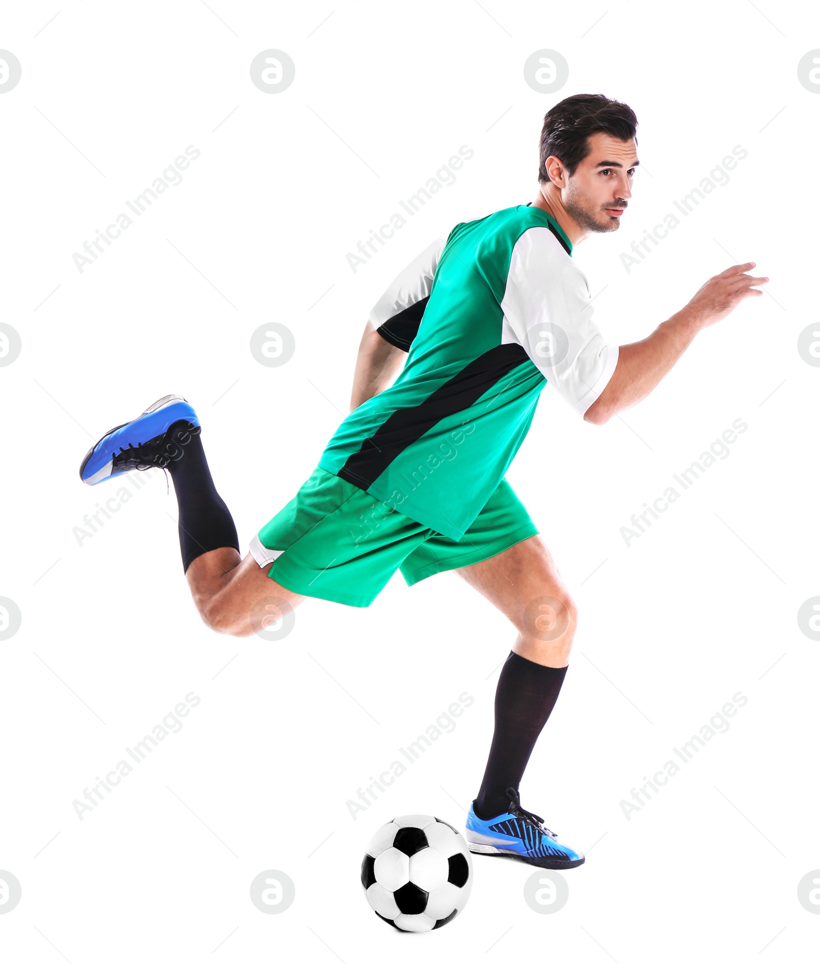 Photo of Young man playing football on white background