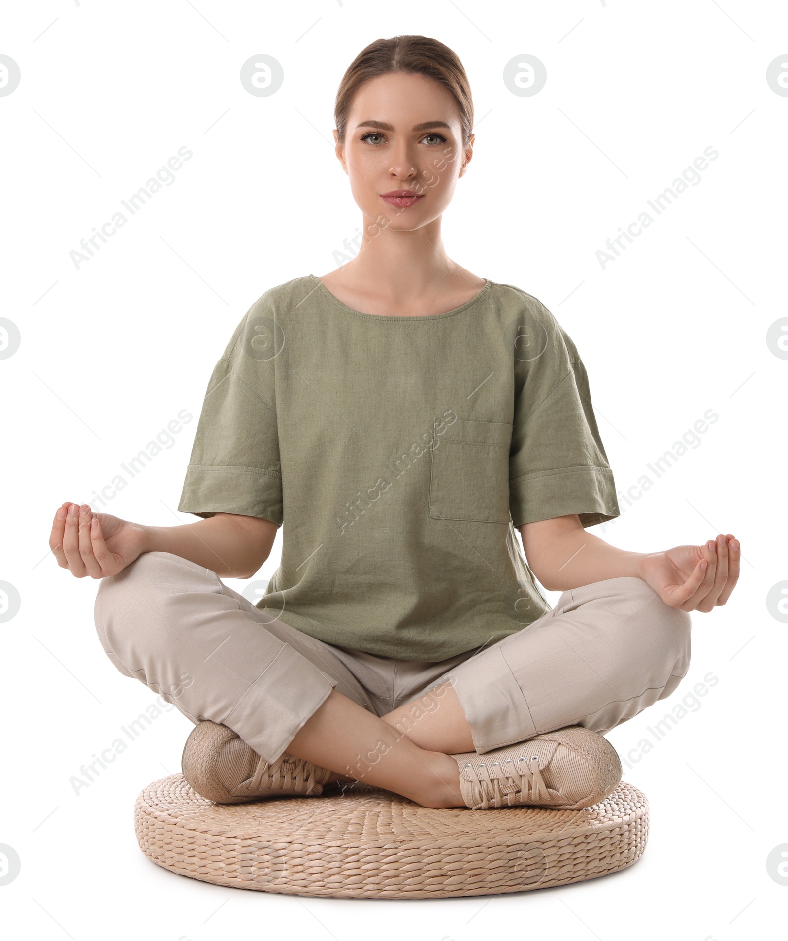 Photo of Beautiful young woman meditating on white background