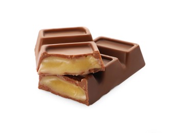 Photo of Pieces of delicious chocolate bar on white background