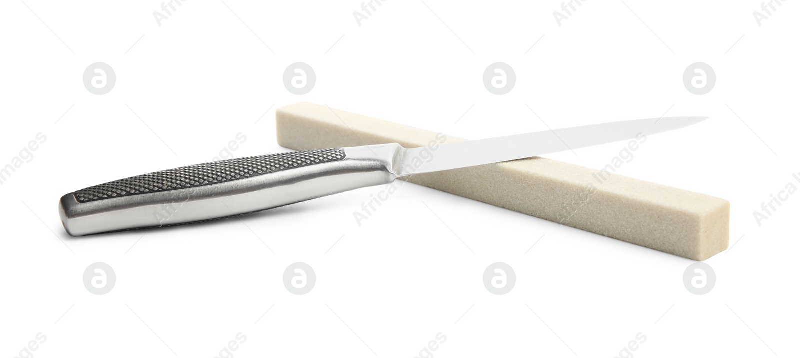 Photo of Sharpening stone and knife on white background