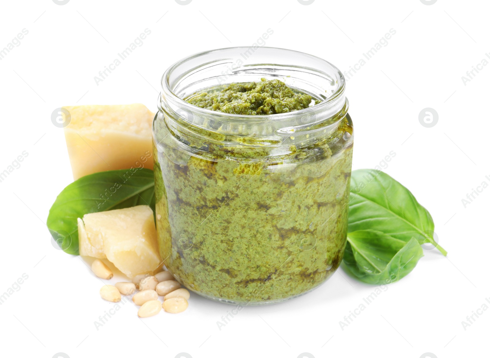 Photo of Fresh tasty pesto sauce, basil and cheese isolated on white