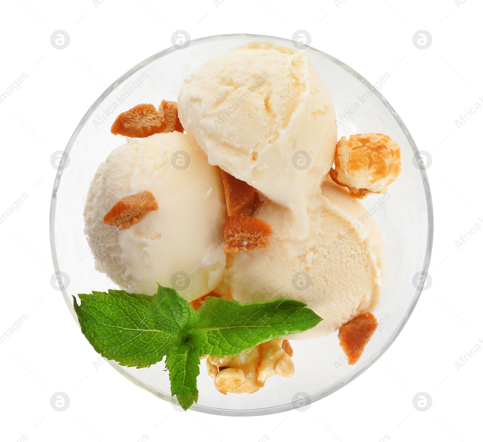 Photo of Delicious ice cream with caramel candies and popcorn in dessert bowl on white background, top view