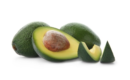 Photo of Ripe avocados on white background. Tropical fruit