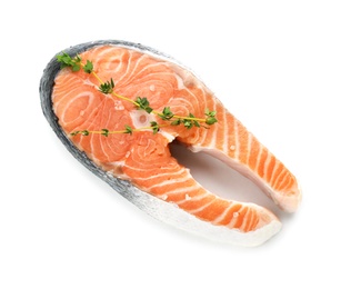 Photo of Fresh salmon steak with thyme on white background, top view