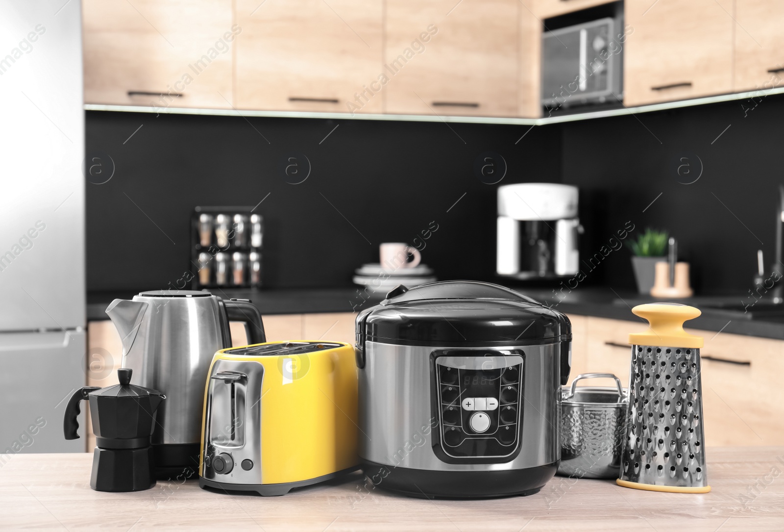 Photo of Set with modern domestic appliances in kitchen