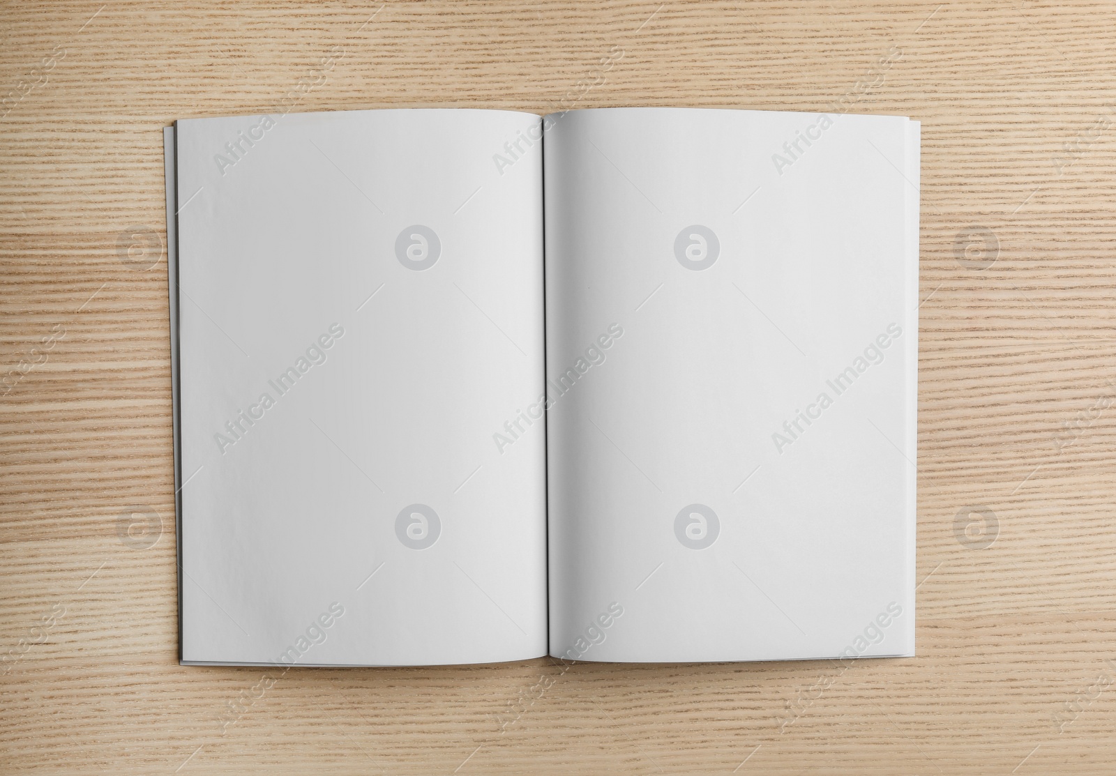 Photo of Mockup of open brochure on wooden background, top view