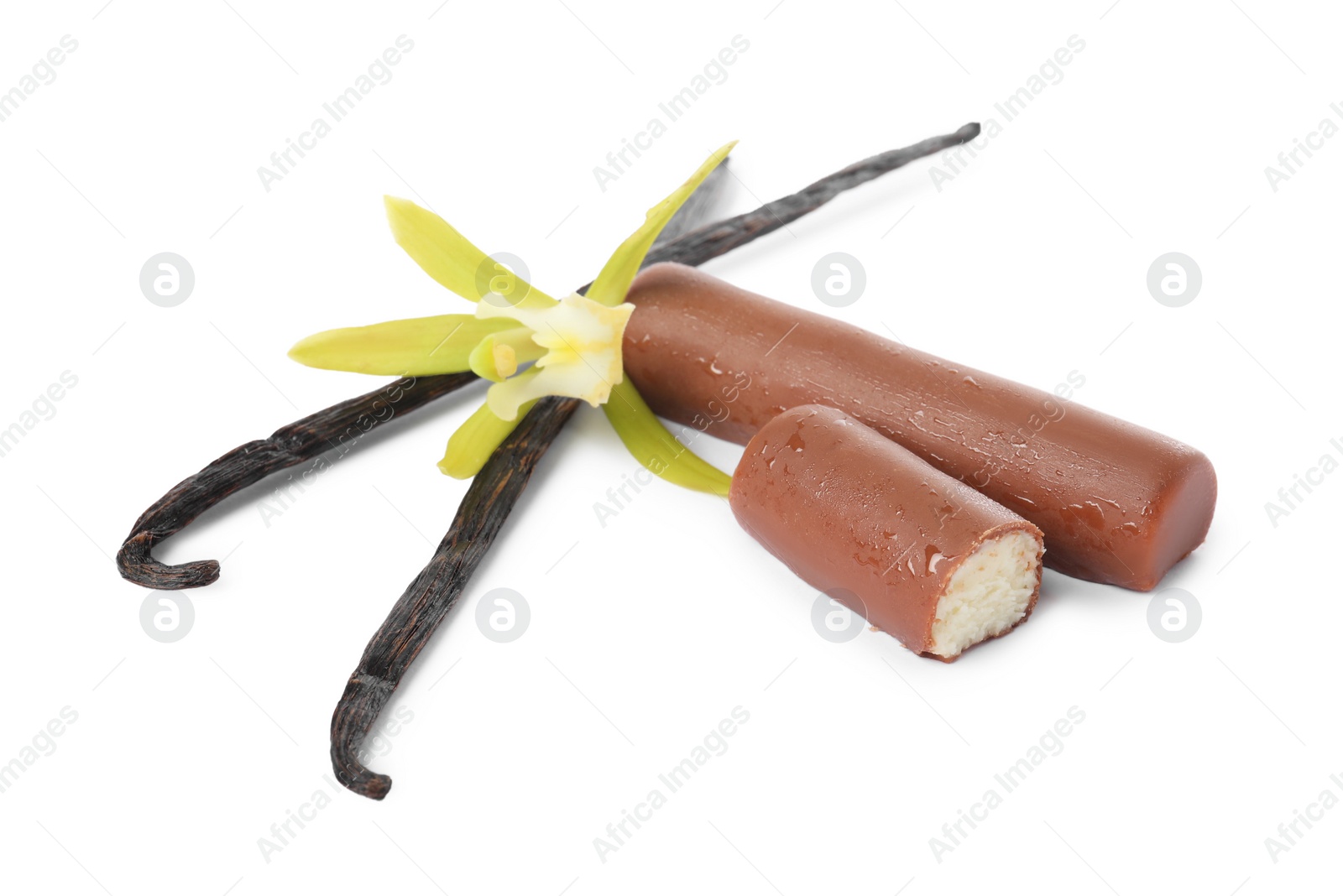 Photo of Glazed curd cheese bars, vanilla pods and flower isolated on white