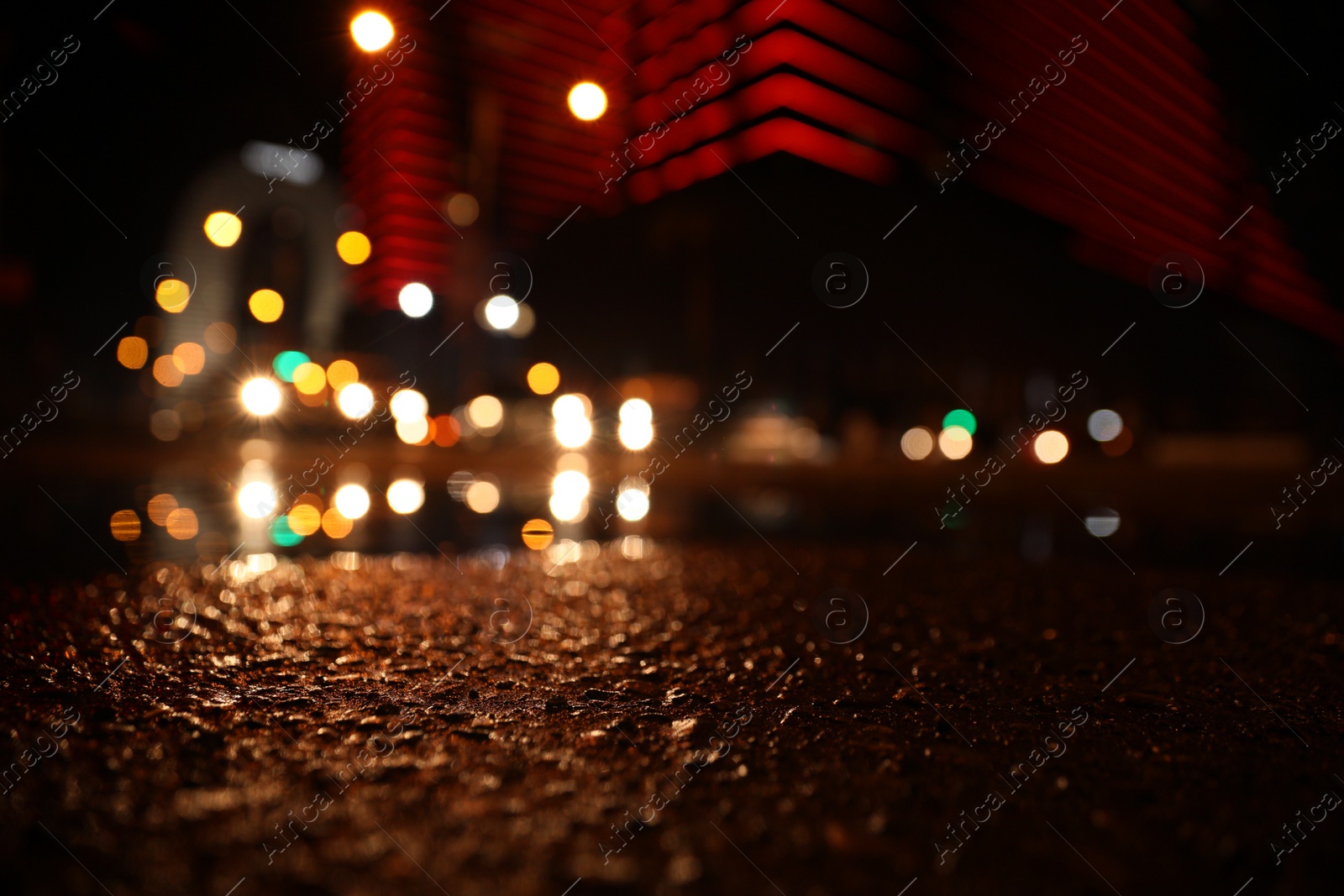 Photo of View of cityscape with bokeh effect, focus on asphalt. Night life