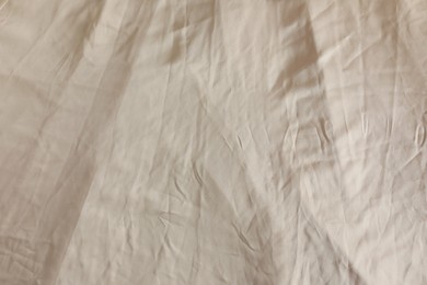 Crumpled dark beige fabric as background, closeup view