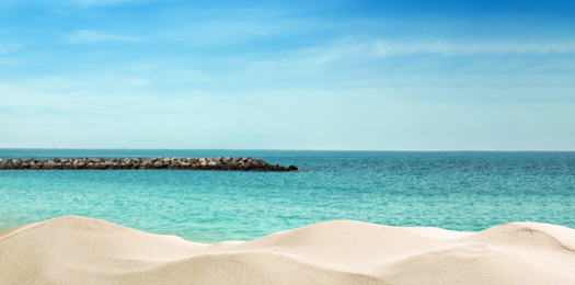 Image of Beautiful beach with golden sand near ocean. Banner design
