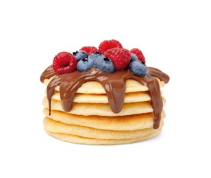 Photo of Stack of tasty pancakes with chocolate spread and berries isolated on white