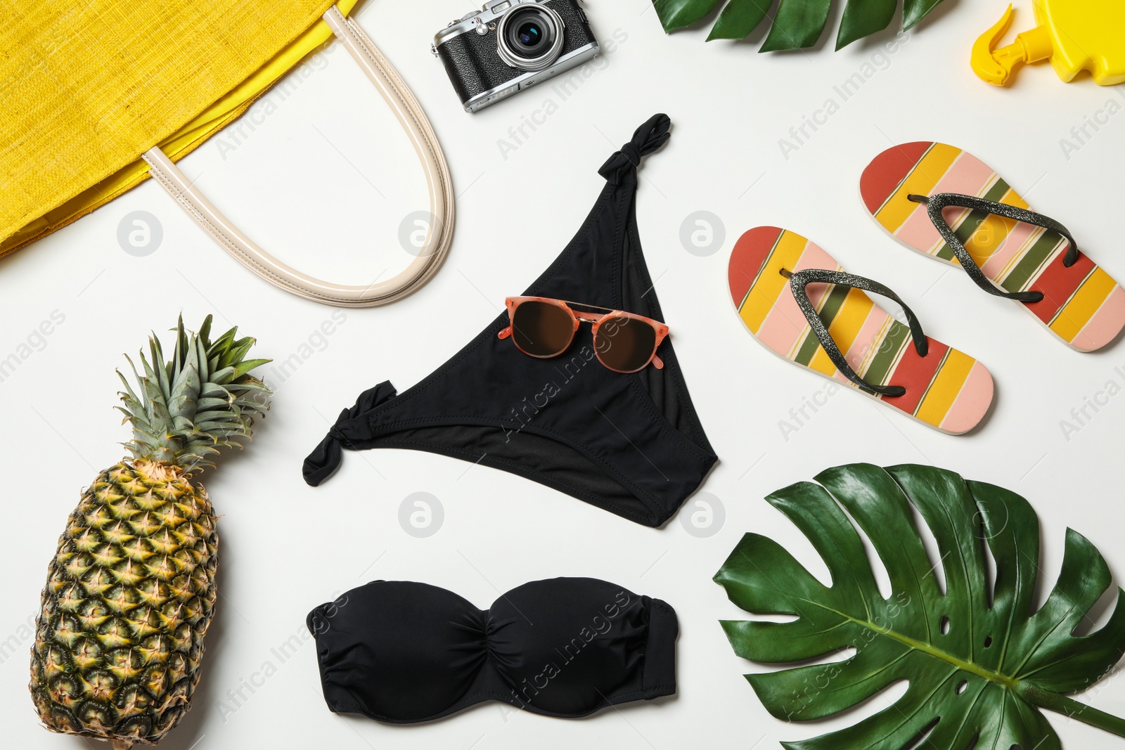 Photo of Flat lay composition with swimsuit and beach accessories on white background