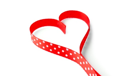 Photo of Heart made of satin ribbon on white background