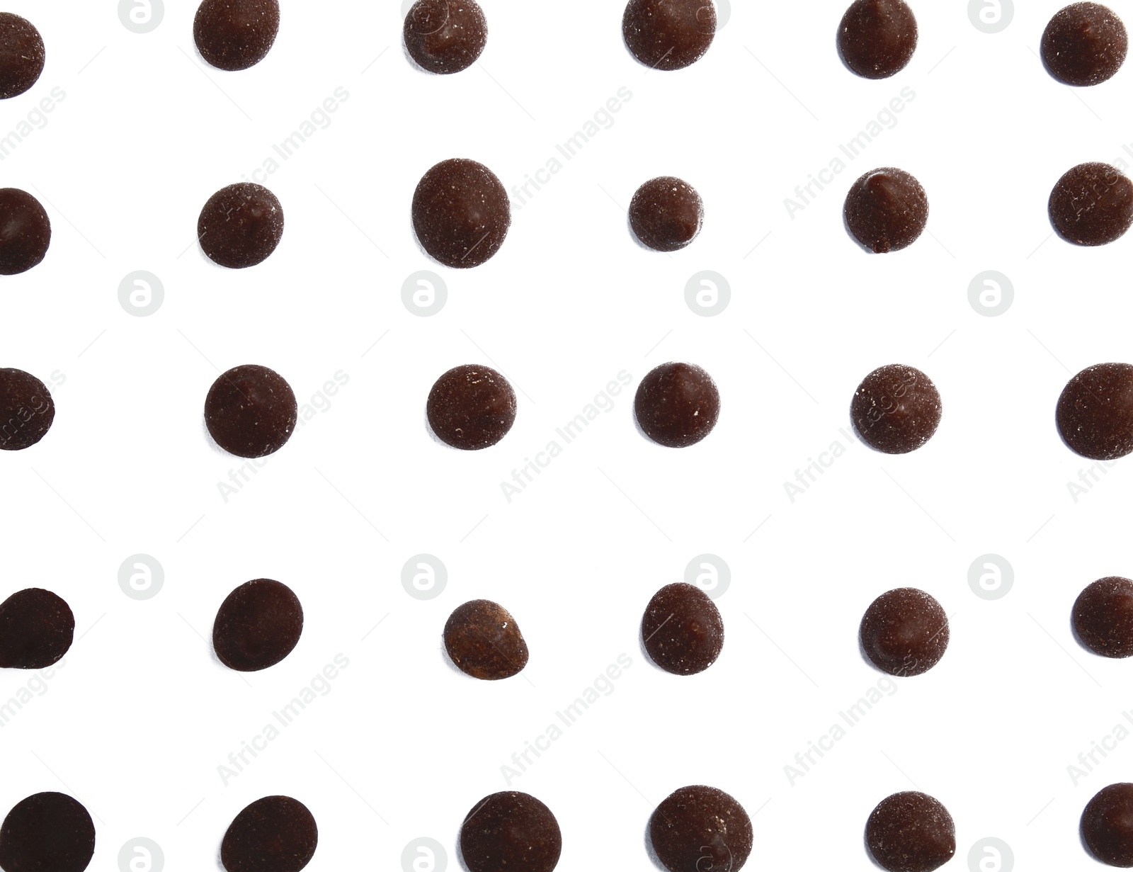 Photo of Delicious dark chocolate chips on white background, flat lay