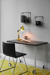 Photo of Modern teenager's room interior with workplace and stylish design elements