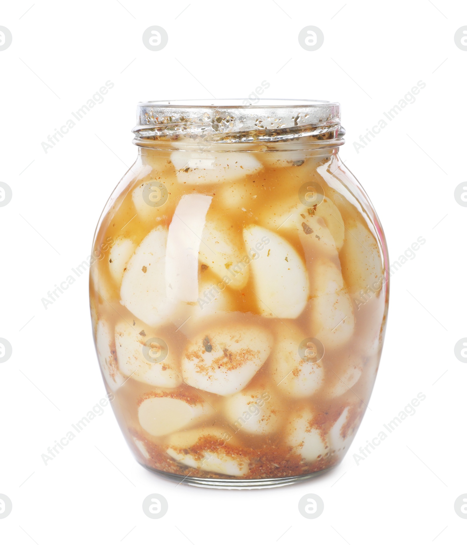 Photo of Glass jar with preserved garlic on white background