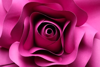 Photo of Beautiful pink flower made of paper as background, top view