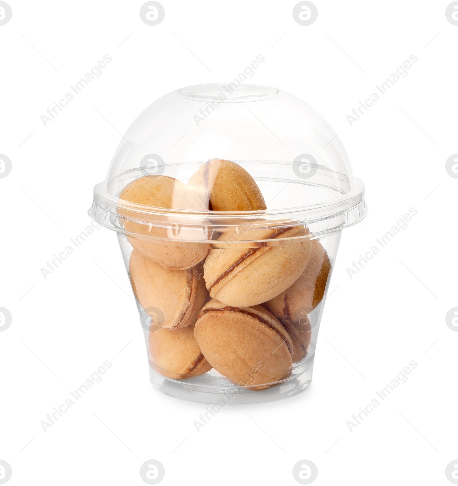 Photo of Delicious nut shaped cookies with boiled condensed milk in plastic up on white background