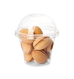 Photo of Delicious nut shaped cookies with boiled condensed milk in plastic up on white background