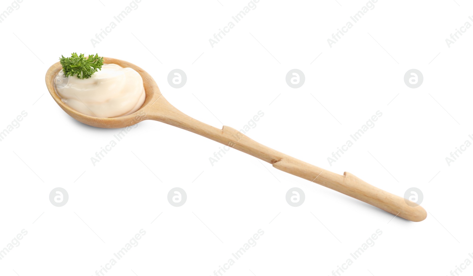 Photo of Wooden spoon with tasty mayonnaise and parsley isolated on white