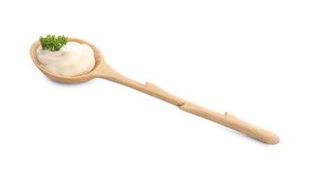 Photo of Wooden spoon with tasty mayonnaise and parsley isolated on white