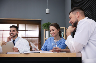 Team of professional doctors having meeting in office