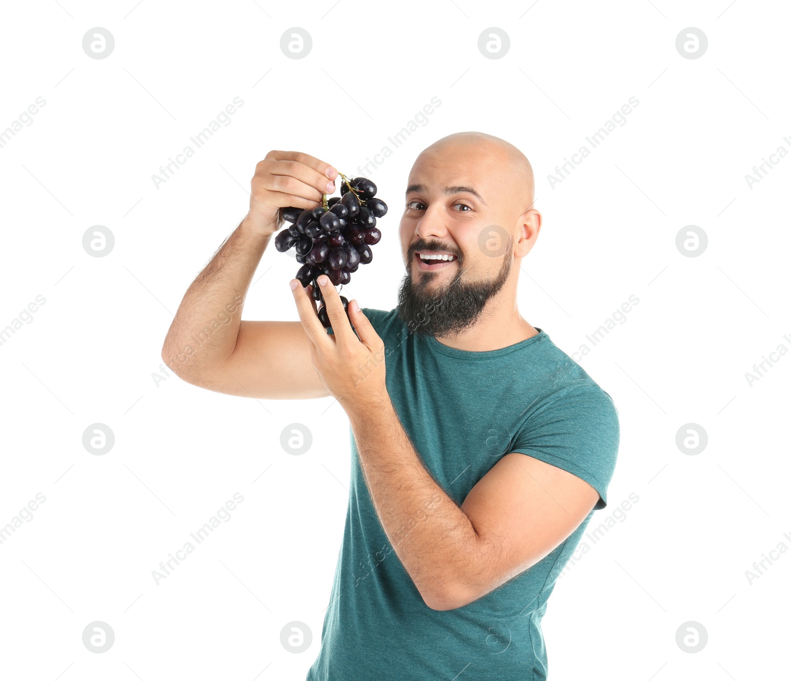 Photo of Overweight man with grapes on white background