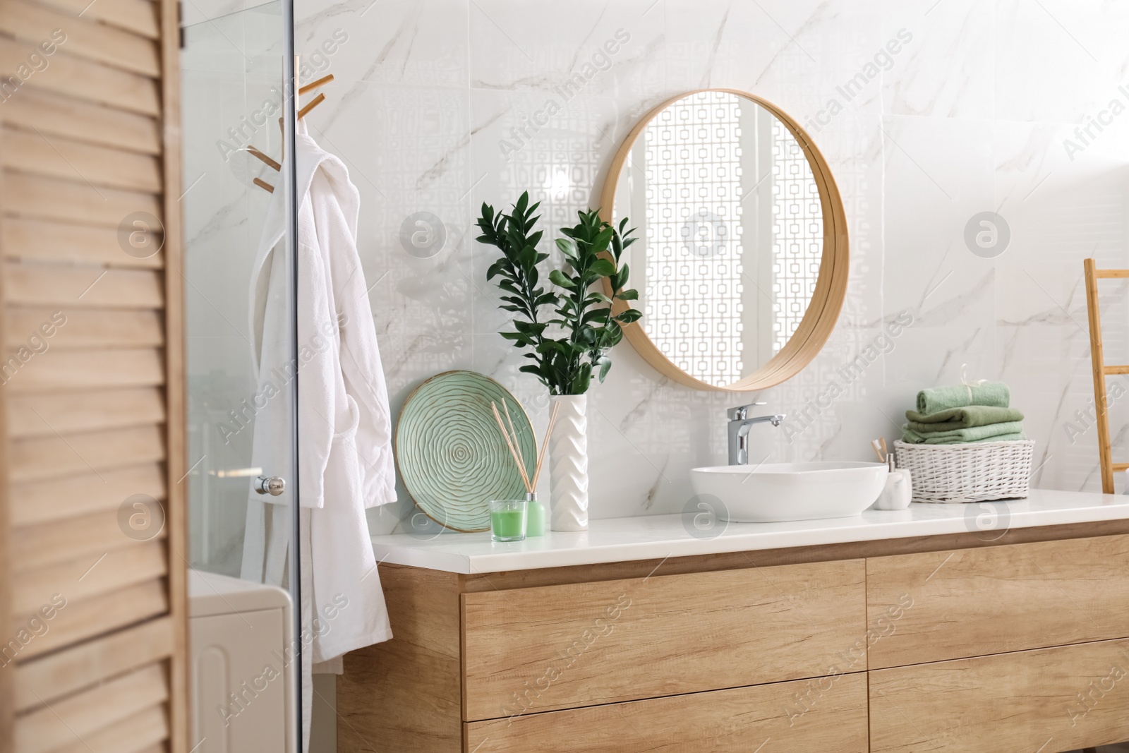 Photo of Modern bathroom interior with stylish mirror and vessel sink