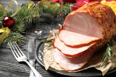 Delicious Christmas ham served on wooden table