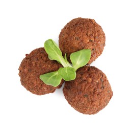 Delicious falafel balls and lambs lettuce on white background, top view. Vegan meat products