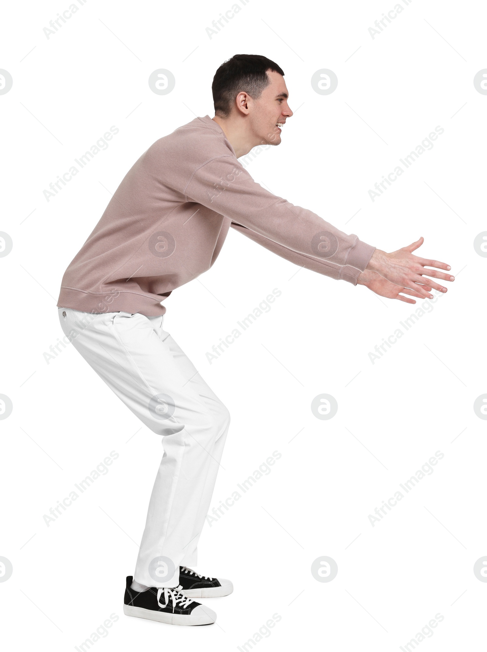 Photo of Handsome young man greeting someone on white background