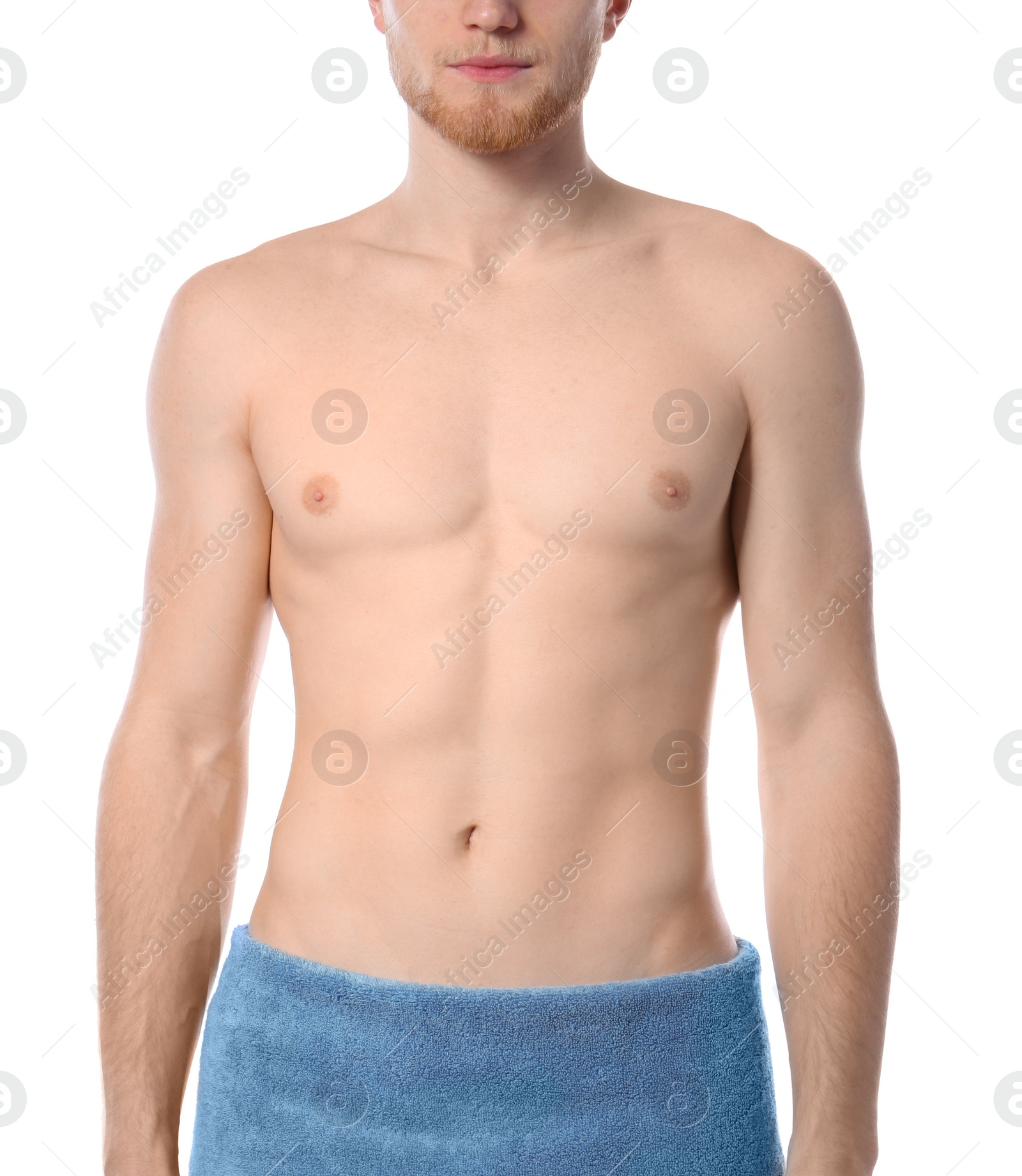 Photo of Young man with slim body in towel on white background, closeup