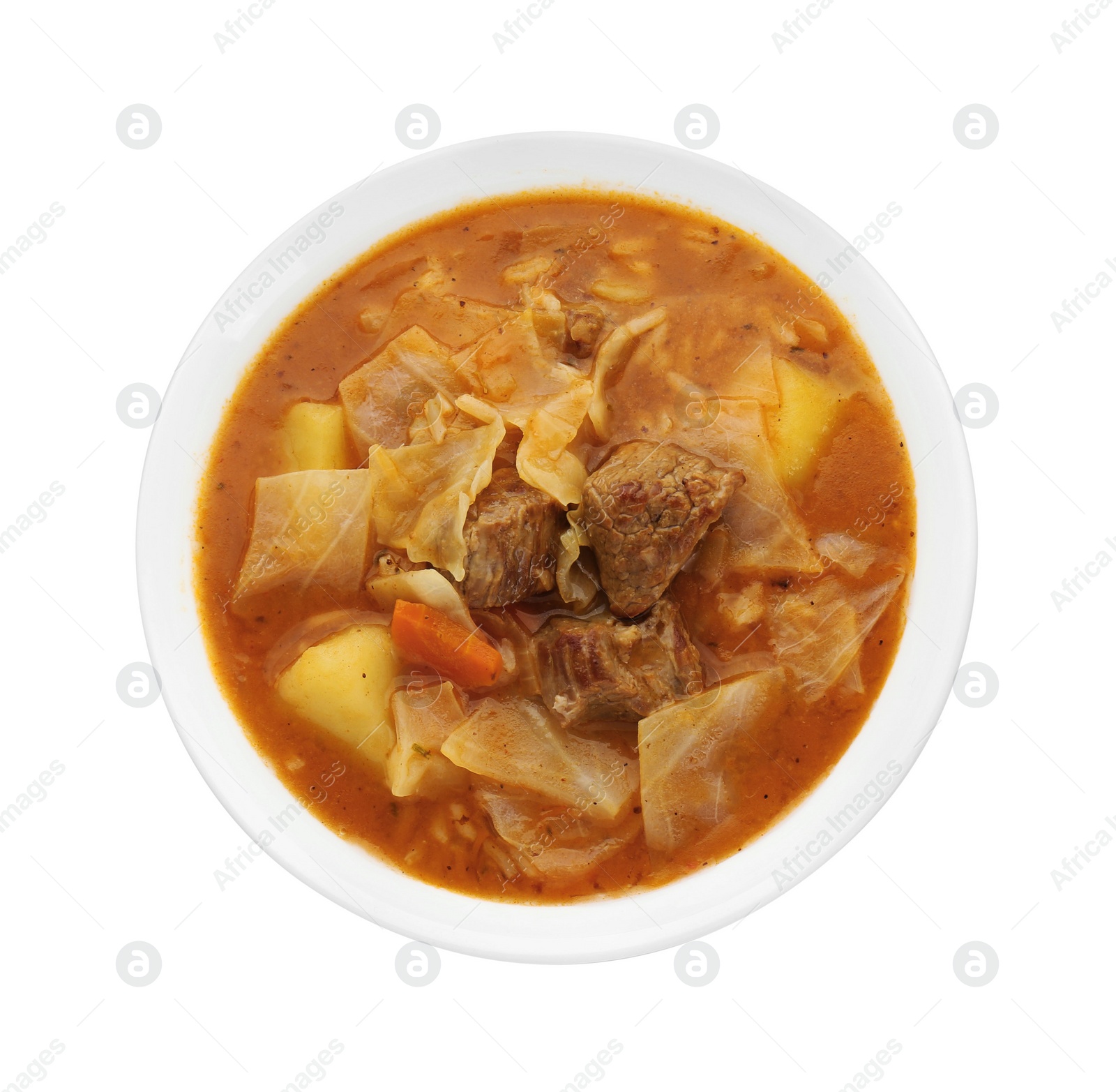 Photo of Tasty cabbage soup with meat and carrot on white background, top view