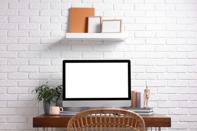 Photo of Cozy workspace with modern computer on wooden desk