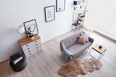 Living room interior with comfortable sofa, view through CCTV camera