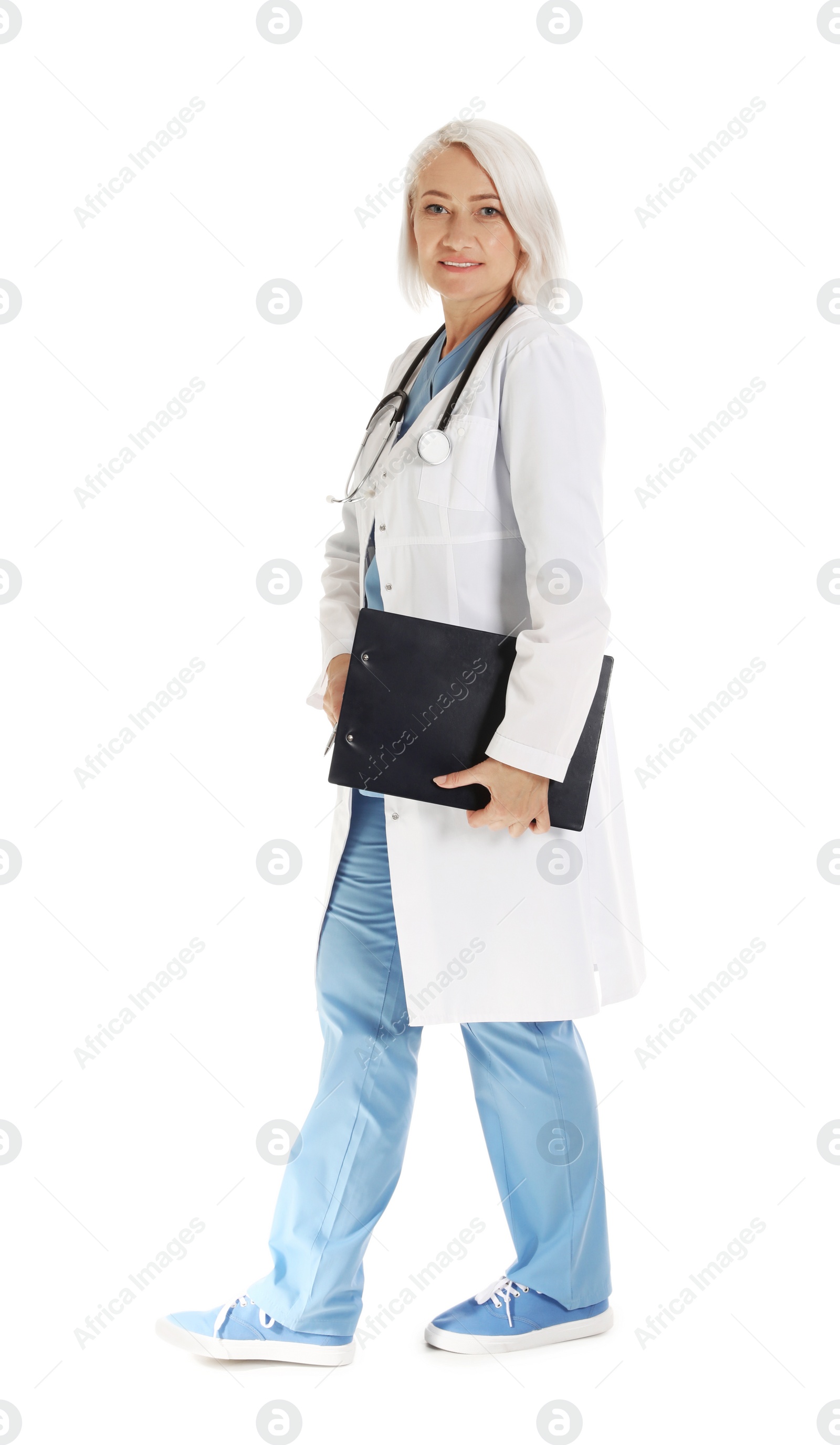 Photo of Full length portrait of female doctor with clipboard isolated on white. Medical staff