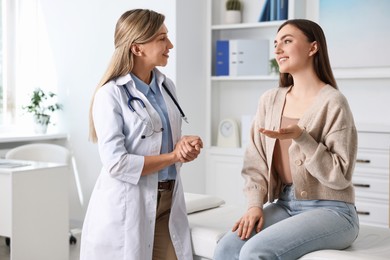 Photo of Professional doctor working with patient in hospital