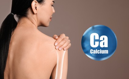 Image of Role of calcium for human. Woman suffering from pain in shoulder on beige background, digital compositing with illustration of bone