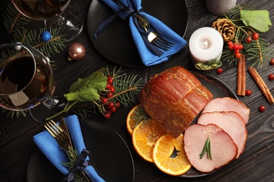 Photo of Flat lay composition with delicious ham on black wooden table. Christmas dinner