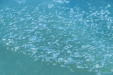 Photo of Pieces of cracked ice in river water. Early spring