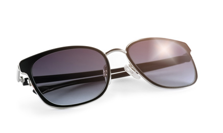 Photo of Stylish sunglasses on white background. Summer accessory
