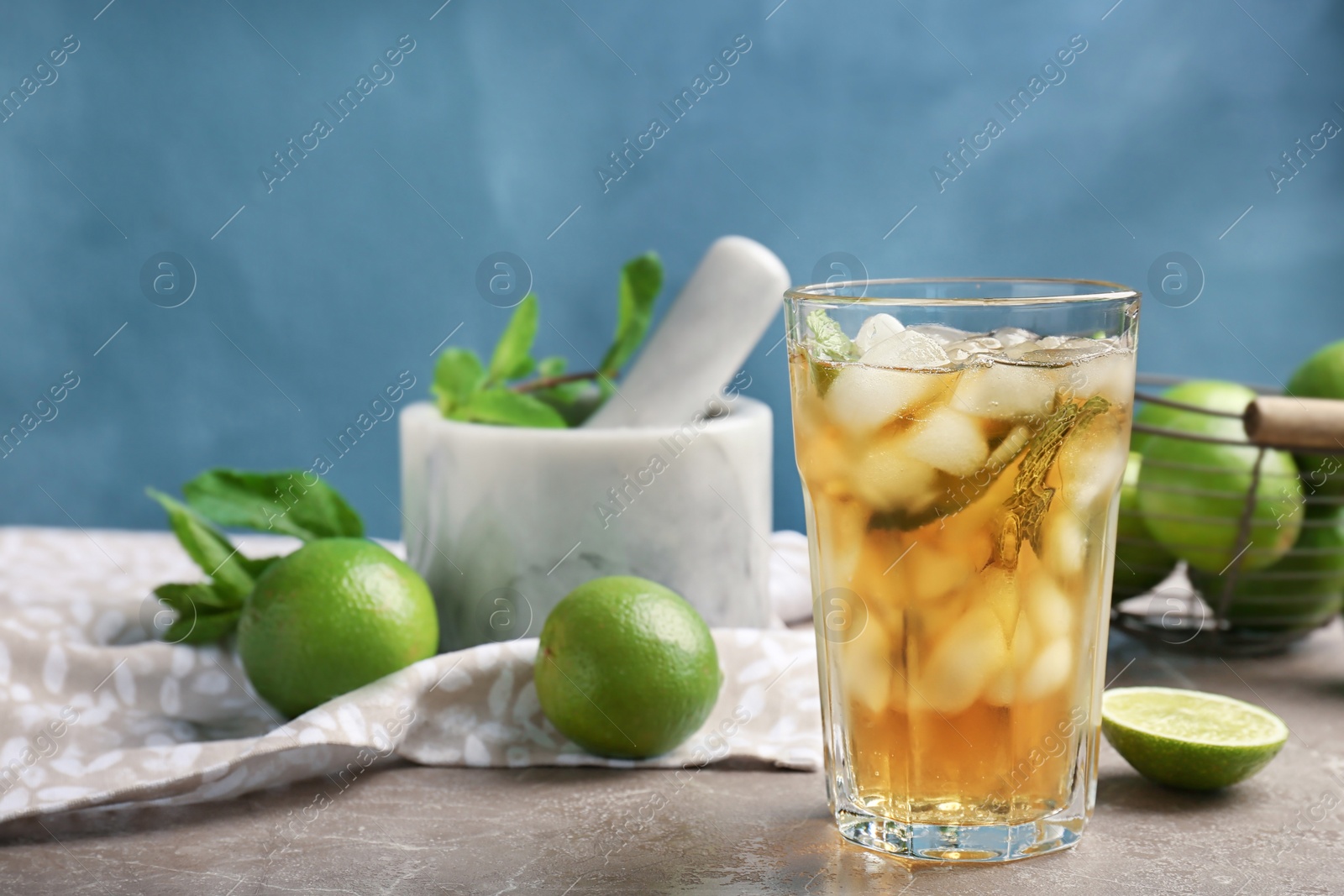 Photo of Composition with delicious mint julep cocktail on table