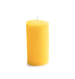 Yellow pillar wax candle on white background